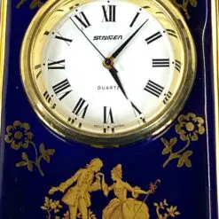 Staiger stalinis kvarcinis laikrodis porcelianiniame Legle Limoges rėme 3,5×7,5×8,5 cm