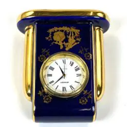 Staiger stalinis kvarcinis laikrodis porcelianiniame Legle Limoges rėme 3,5×7,5×8,5 cm