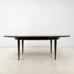 Ovalus išskleidžiamas raudonmedžio valgomojo stalas su žalvario apdailomis 106×171(+60)x77,5 cm