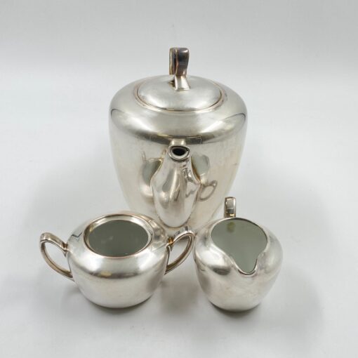 Metalinių su keramikiniu vidumi arbatinuko (1600 ml) 15x25x21 cm, ąsotėlio (200 ml) 9x12x7,5 cm ir cukrinės 10x15x8 cm 3 vnt. komplektas