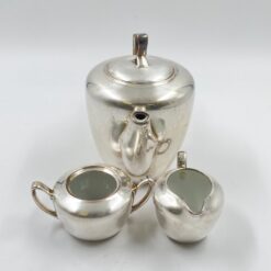 Metalinių su keramikiniu vidumi arbatinuko (1600 ml) 15x25x21 cm, ąsotėlio (200 ml) 9x12x7,5 cm ir cukrinės 10x15x8 cm 3 vnt. komplektas