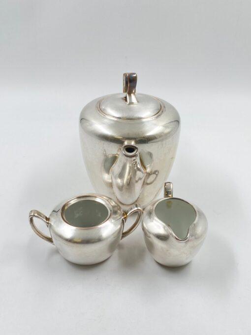 Metalinių su keramikiniu vidumi arbatinuko (1600 ml) 15x25x21 cm, ąsotėlio (200 ml) 9x12x7,5 cm ir cukrinės 10x15x8 cm 3 vnt. komplektas