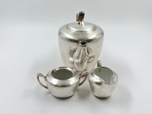 Metalinių su keramikiniu vidumi arbatinuko (1600 ml) 15x25x21 cm, ąsotėlio (200 ml) 9x12x7,5 cm ir cukrinės 10x15x8 cm 3 vnt. komplektas