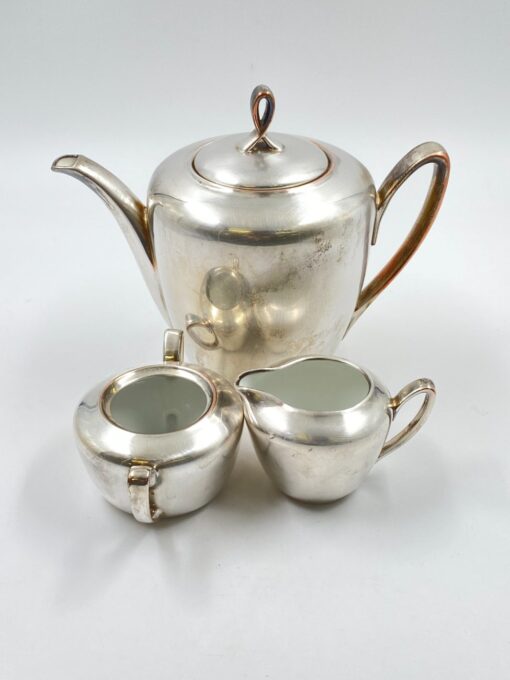 Metalinių su keramikiniu vidumi arbatinuko (1600 ml) 15x25x21 cm, ąsotėlio (200 ml) 9x12x7,5 cm ir cukrinės 10x15x8 cm 3 vnt. komplektas