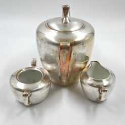 Metalinių su keramikiniu vidumi arbatinuko (1600 ml) 15x25x21 cm, ąsotėlio (200 ml) 9x12x7,5 cm ir cukrinės 10x15x8 cm 3 vnt. komplektas