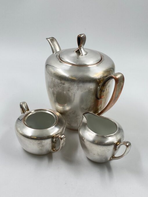 Metalinių su keramikiniu vidumi arbatinuko (1600 ml) 15x25x21 cm, ąsotėlio (200 ml) 9x12x7,5 cm ir cukrinės 10x15x8 cm 3 vnt. komplektas