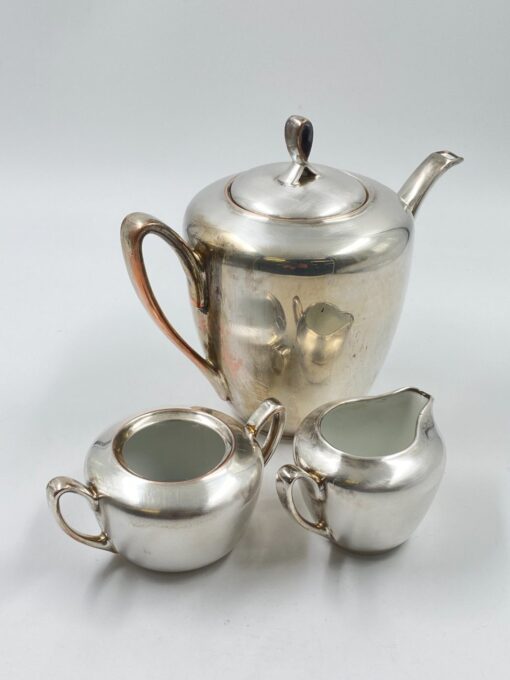 Metalinių su keramikiniu vidumi arbatinuko (1600 ml) 15x25x21 cm, ąsotėlio (200 ml) 9x12x7,5 cm ir cukrinės 10x15x8 cm 3 vnt. komplektas
