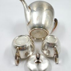 Metalinių su keramikiniu vidumi arbatinuko (1600 ml) 15x25x21 cm, ąsotėlio (200 ml) 9x12x7,5 cm ir cukrinės 10x15x8 cm 3 vnt. komplektas