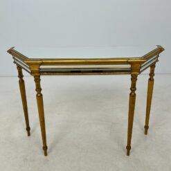 Aukso spalvos medinė konsolė veidrodiniu stalviršiumi 38x120x83,5 cm