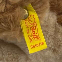 Vintažinis “Steiff” pliušinis gulintis šuo 5610/18 11,5x24x10 cm