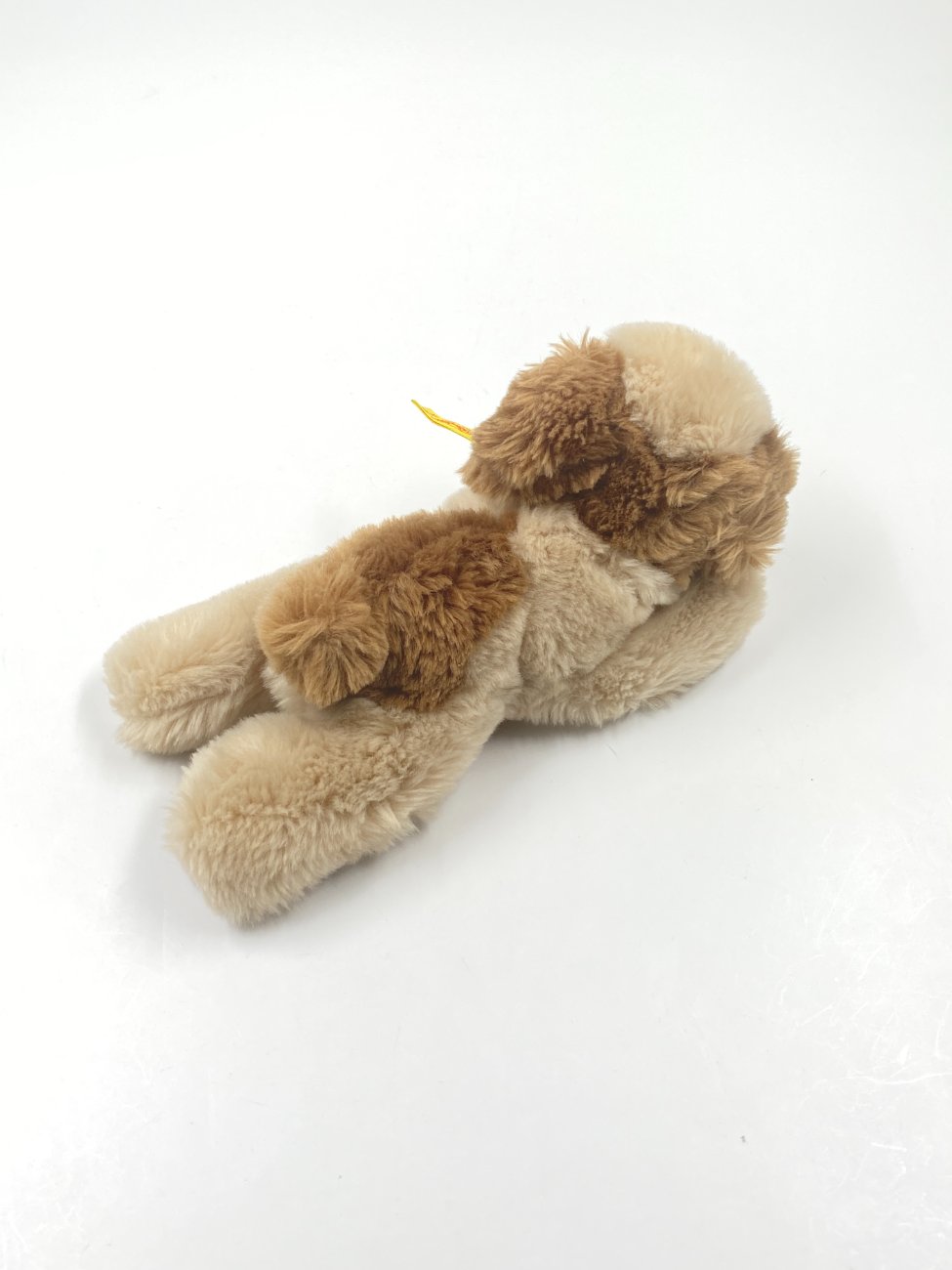 HN0420-zaislai-8 Vintažinis “Steiff” pliušinis gulintis šuo 5610/18 11,5x24x10 cm