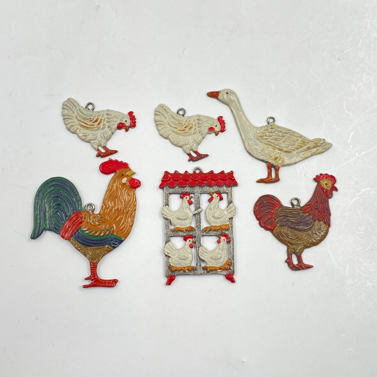 HN0479-interjero-ir-apdailos-prekes-0 “Kühn Zinn” alaviniai liejiniai – dekoracijos vištidės tematika 6 vnt. komplektas 0,2x5x6 cm