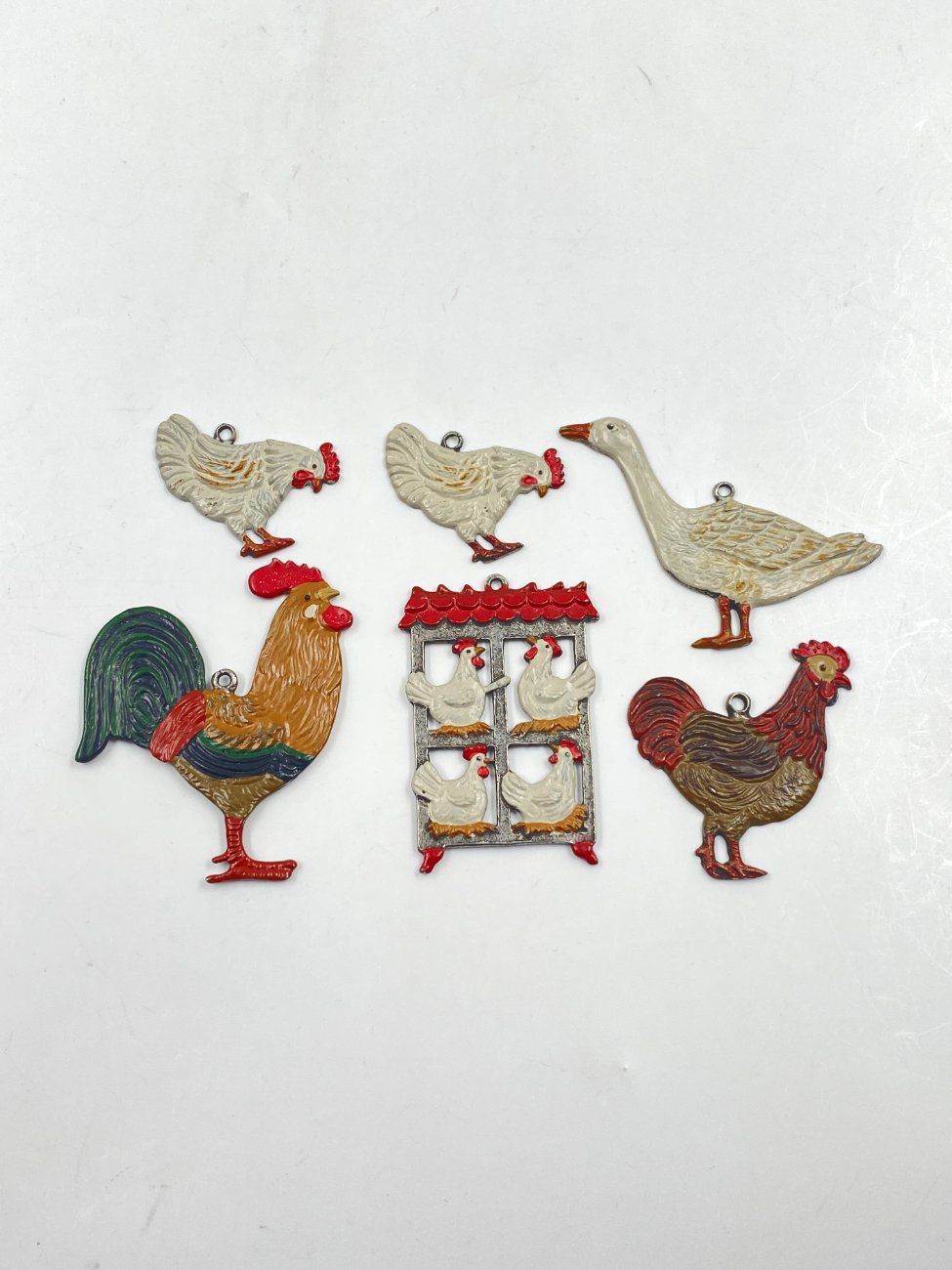 HN0479-interjero-ir-apdailos-prekes-1 “Kühn Zinn” alaviniai liejiniai – dekoracijos vištidės tematika 6 vnt. komplektas 0,2x5x6 cm