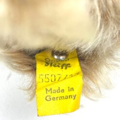 Vintažinis “Steiff” gulintis pliušinis meškinas 5507/17 15x19x8 cm