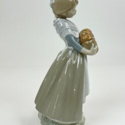 Porcelianinė NAO by Lladró mergaitės su moliūgais statula 14x17x30 cm