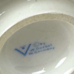 Porcelianinė M. I. Hummel Goebel statula A stitch in time 7x7x17 cm