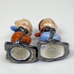 Porcelianinės Goebel druskinė ir pipirinė slidininkų figūrėlės 2 vnt. kompl.