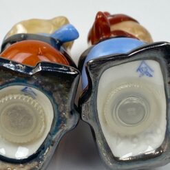 Porcelianinės Goebel druskinė ir pipirinė slidininkų figūrėlės 2 vnt. kompl.