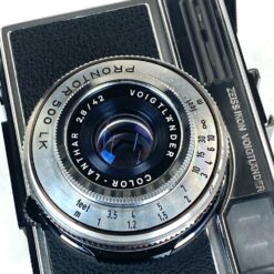 Vintažinis vokiškas Zeiss Ikon Voigtländer Vitessa 500S juostinis fotoaparatas su odiniu dėklu